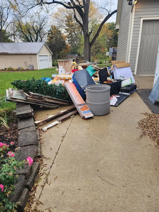 Dumpster being loaded with debris for Demolition Dumpster Rental in Moyock